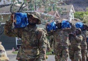 US soldiers delivering supplies, possibly related to the Red Hill Registry mission.