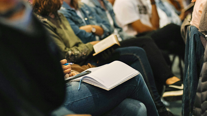 Attendees at a UH Red Hill Registry town hall meeting, taking notes.